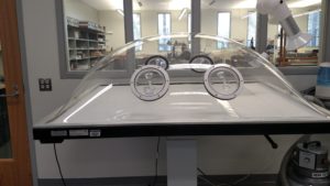 A humidification dome allows materials to be processed with regulated moisture, such as may be required for flattening brittle papers. The dome sits atop a suction table which allows the conservator to force solvents into the paper.